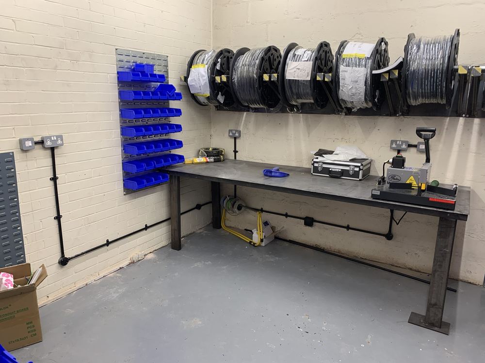 Workshop fitted out with sockets and containment